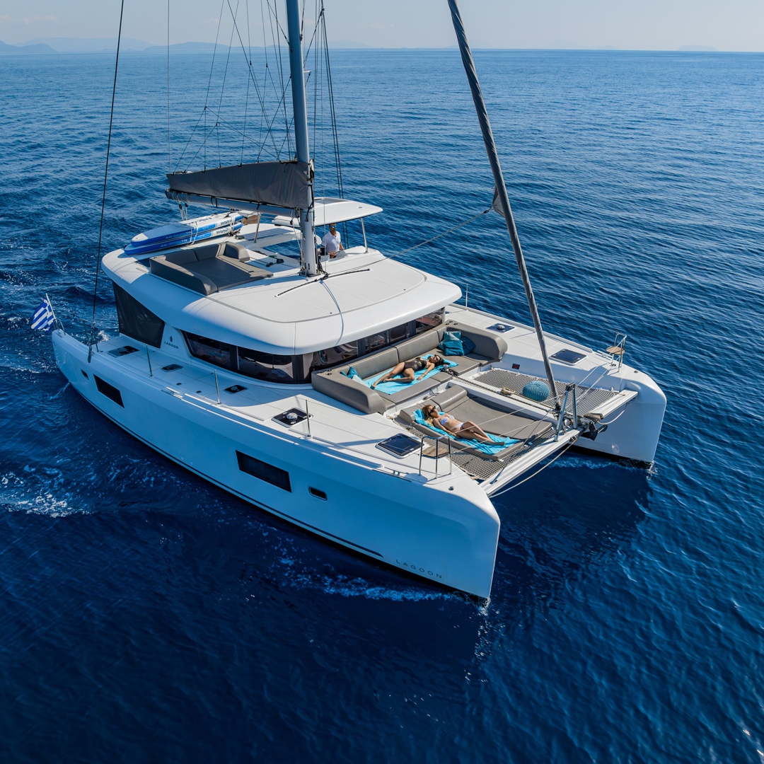 Guests relaxing on Catamaran JOY near Meganisi.