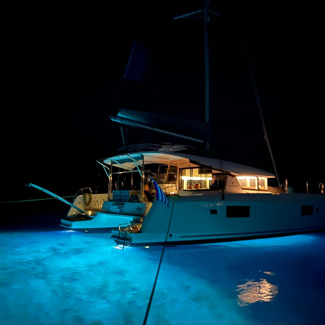 Relaxing on the catamaran deck under a starry sky.